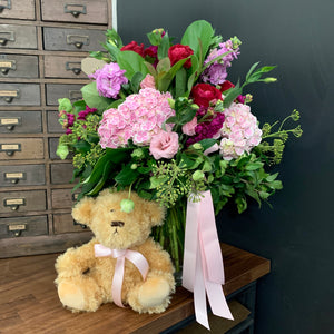 Flowers in A Vase With Teddy