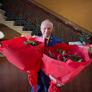 *Two Dozen Roses in Glass Vase